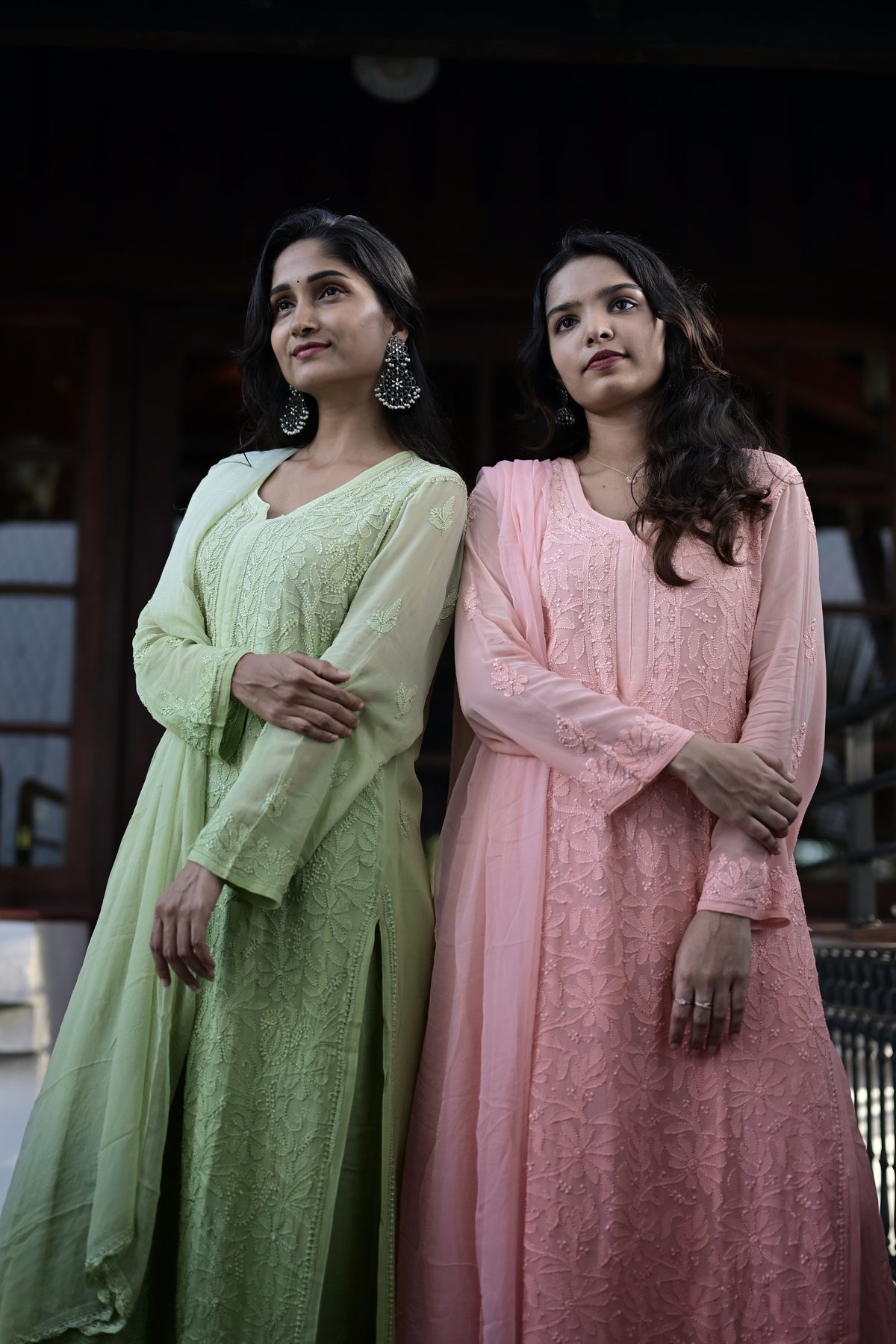 Two models wearing pale green and blush House of Murri embroidered kurthas