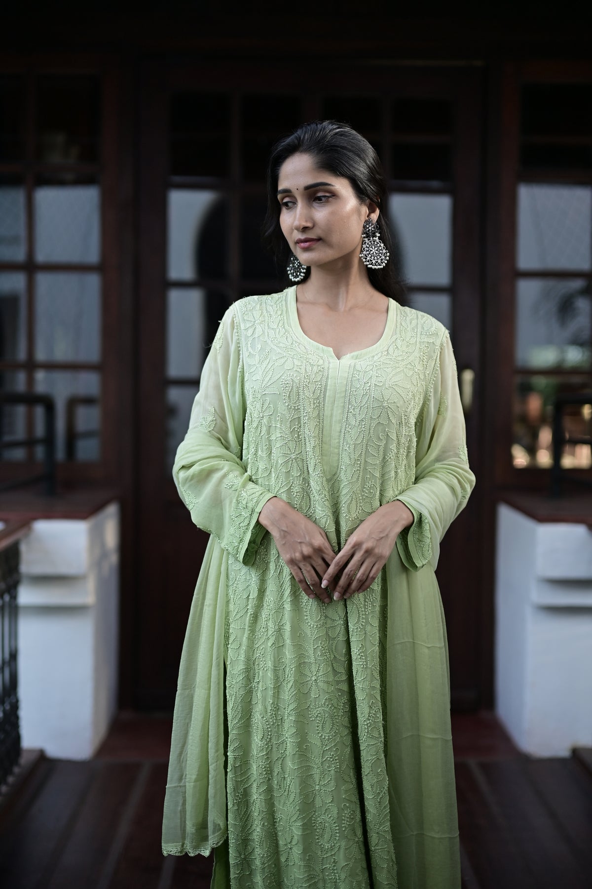 Pale green House of Murri kurtha showing tonal floral embroidery and sleeve detail