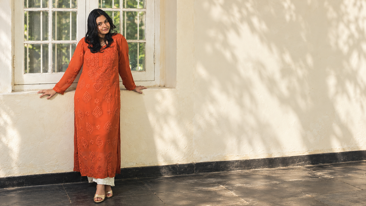 Gul in orange, in an AI-assisted veranda editorial based on the original release photograph